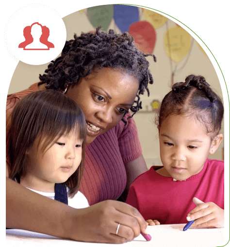 A woman and two children are writing on paper.